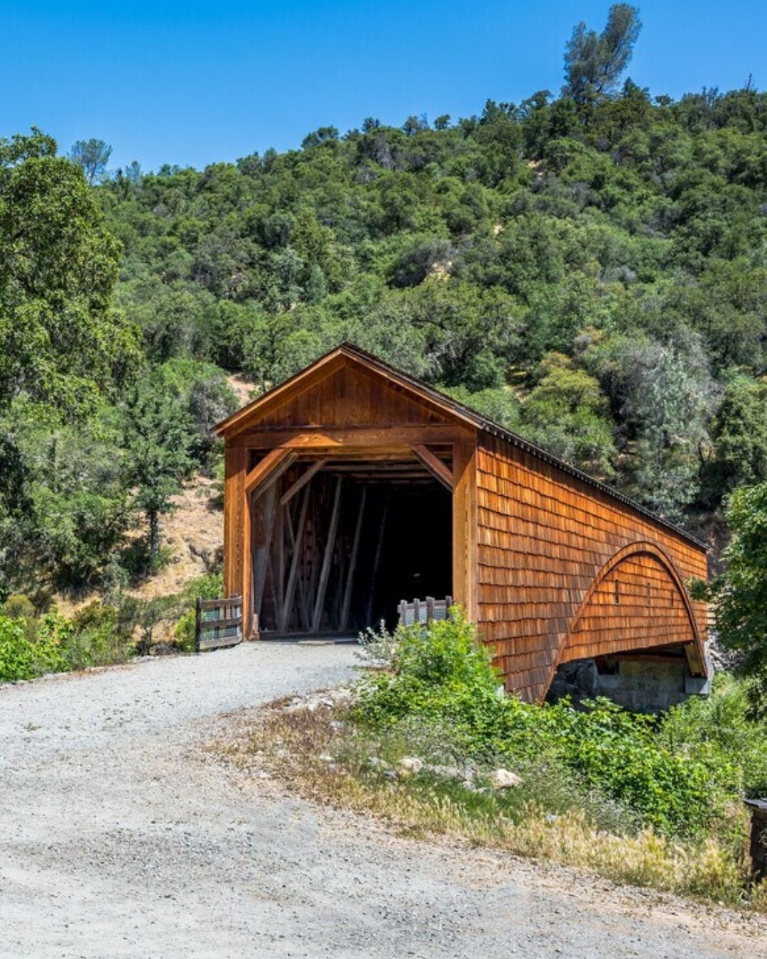 Historic Bridgeport Covered Bridge in Penn Valley surrounded by green hills